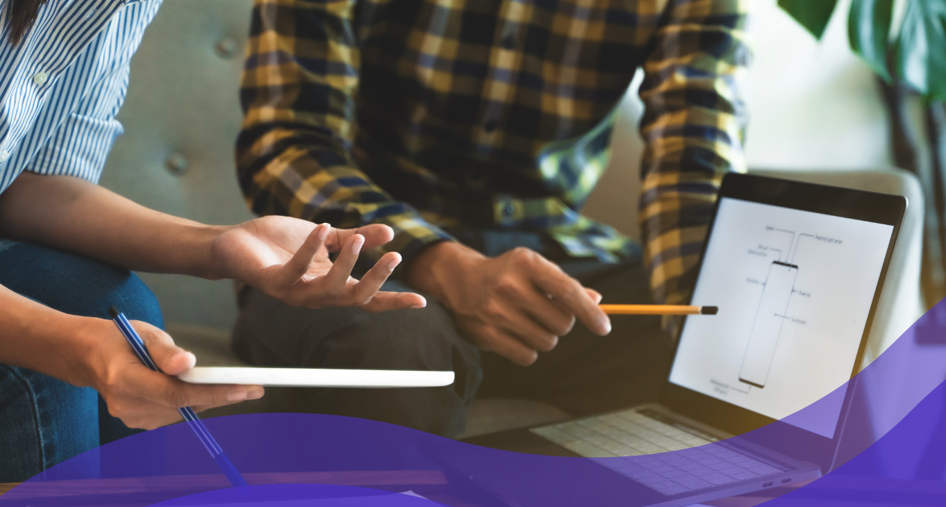 people analyzing mobile structure on laptop